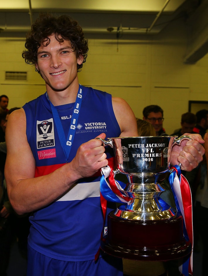 2016 VFL Grand Final - Footscray Bulldogs v Casey Scorpians MELBOURNE, AUSTRALIA - SEPTEMBER 25: Will Minson of Footscray holds up the cup after winning during the VFL Grand Final match between Footscray Bulldogs and Casey Scorpions at Etihad Stadium on September 25, 2016 in Melbourne, Australia. (Photo by Michael Dodge/AFL Media)